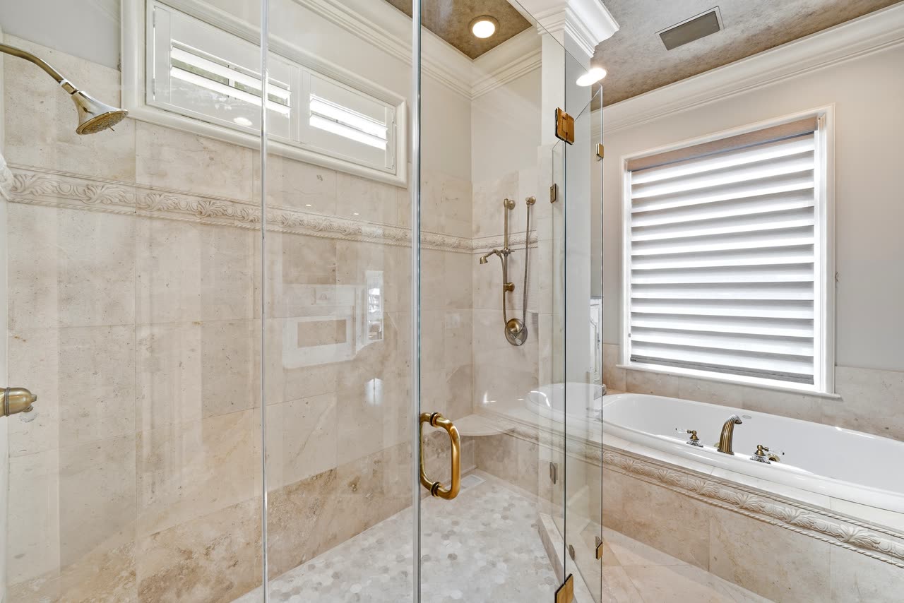 Primary bathroom, travertine and brass