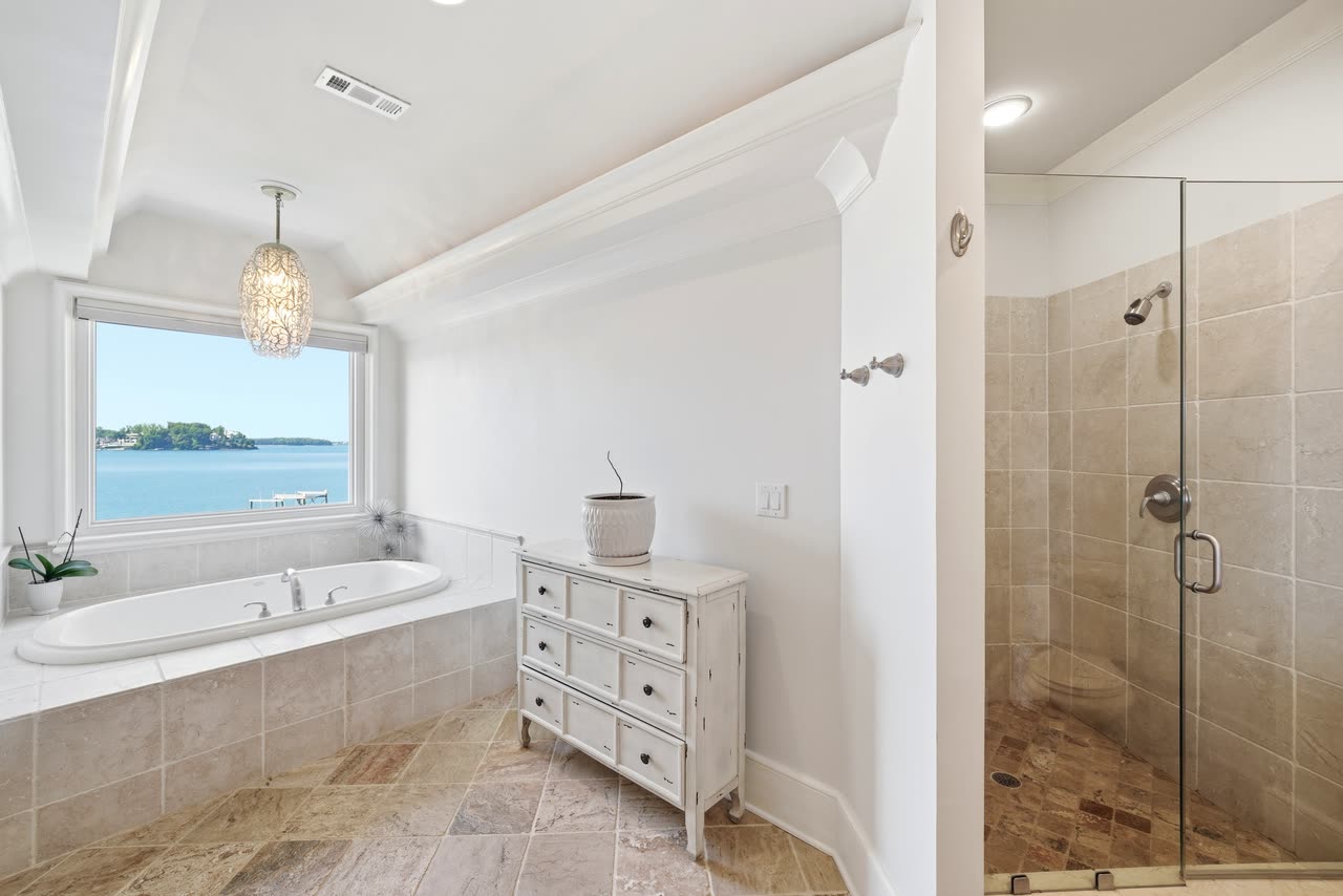 Bathroom with a tub under the window