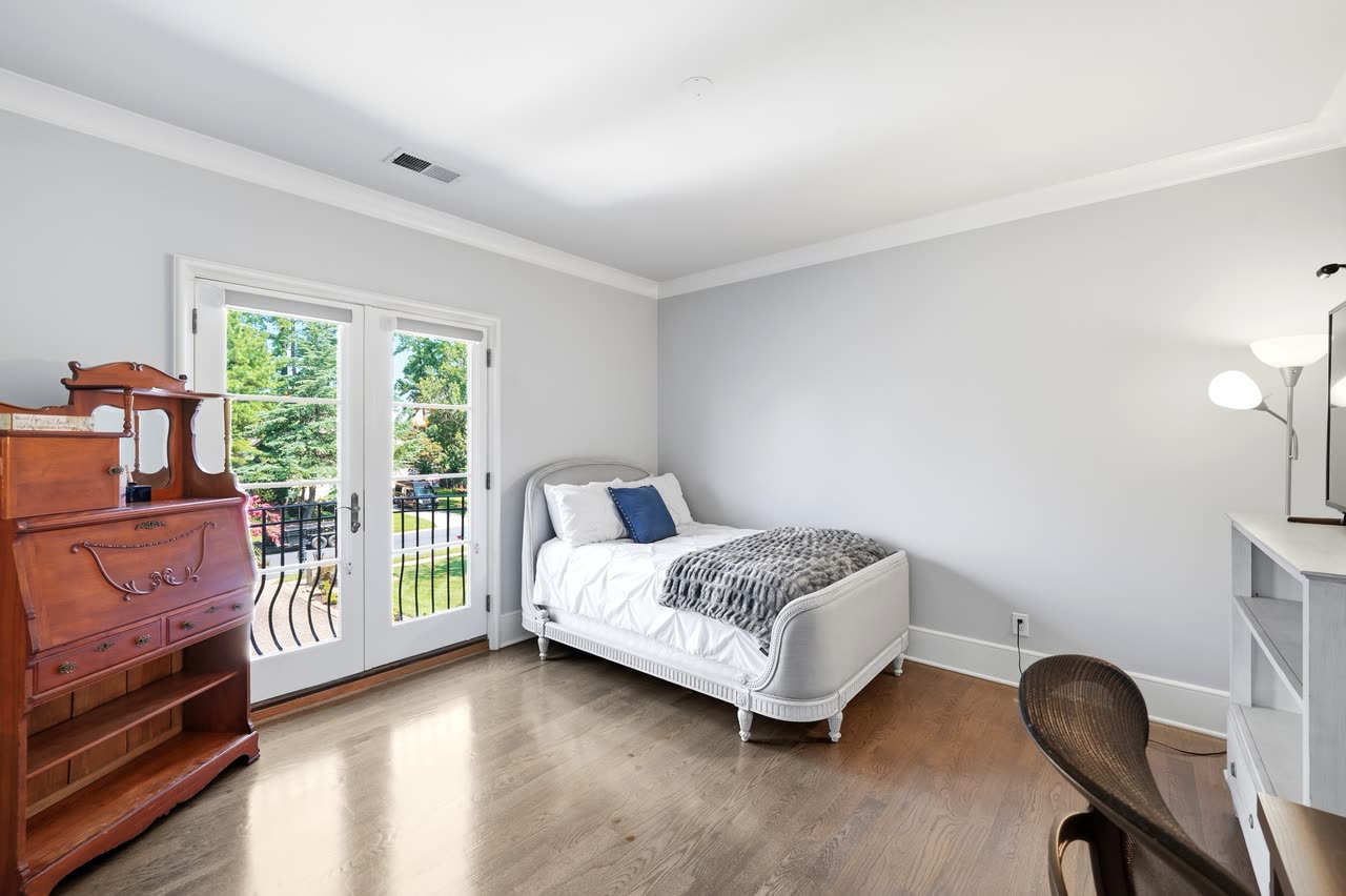 Bedroom with doors to the balcony